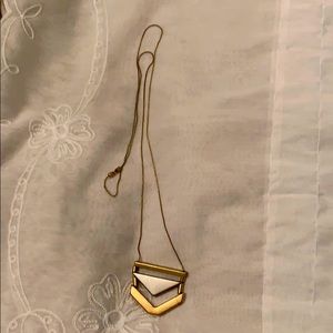 Silver and gold colored necklace.